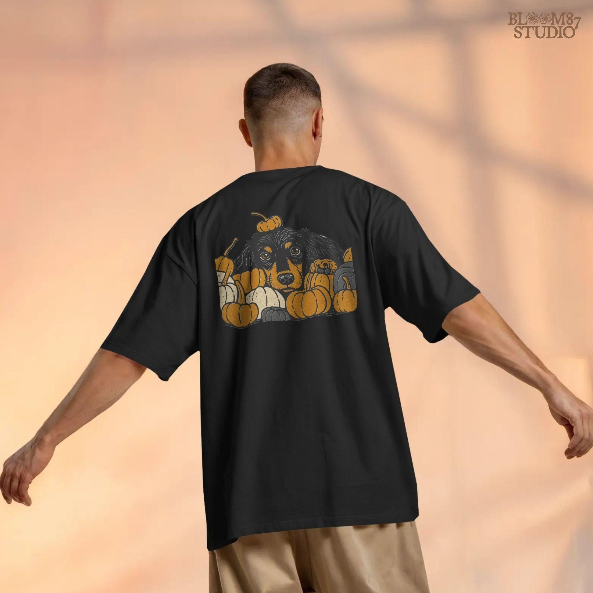 Long-haired dachshund surrounded by fall pumpkins in orange, cream, and gray tones, perfect for autumn sublimation designs and shirts