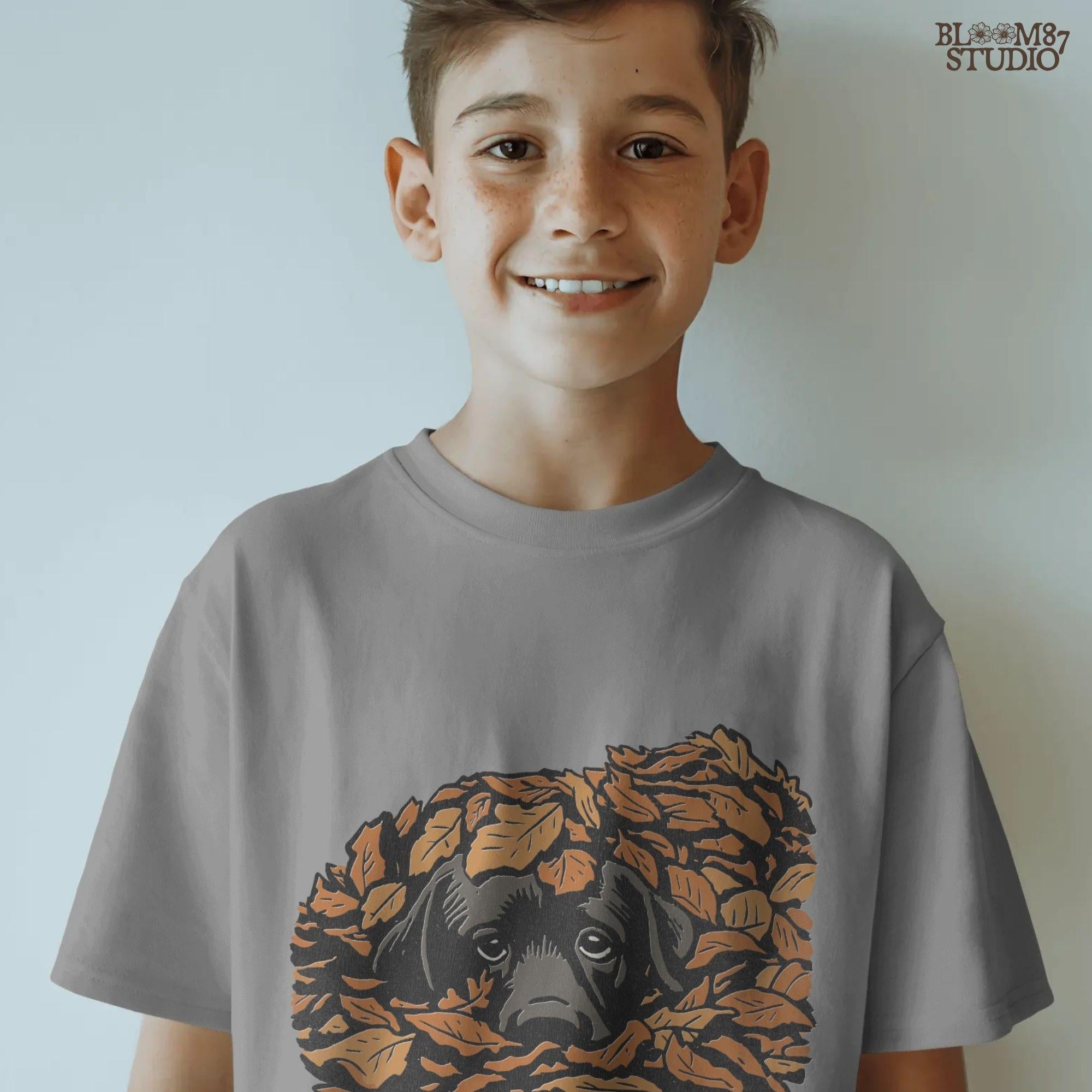 Cute black Labrador retriever peeking through a pile of orange autumn leaves, rustic fall sublimation PNG design