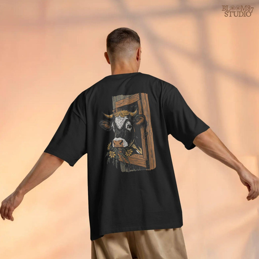 Rustic black and white cow peeking through a wooden barn window, holding yellow wildflowers in its mouth, farm sublimation PNG design