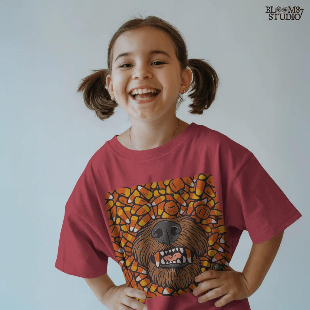 Funny werewolf-style dog face surrounded by candy corn and pumpkins in a Halloween-themed sublimation design