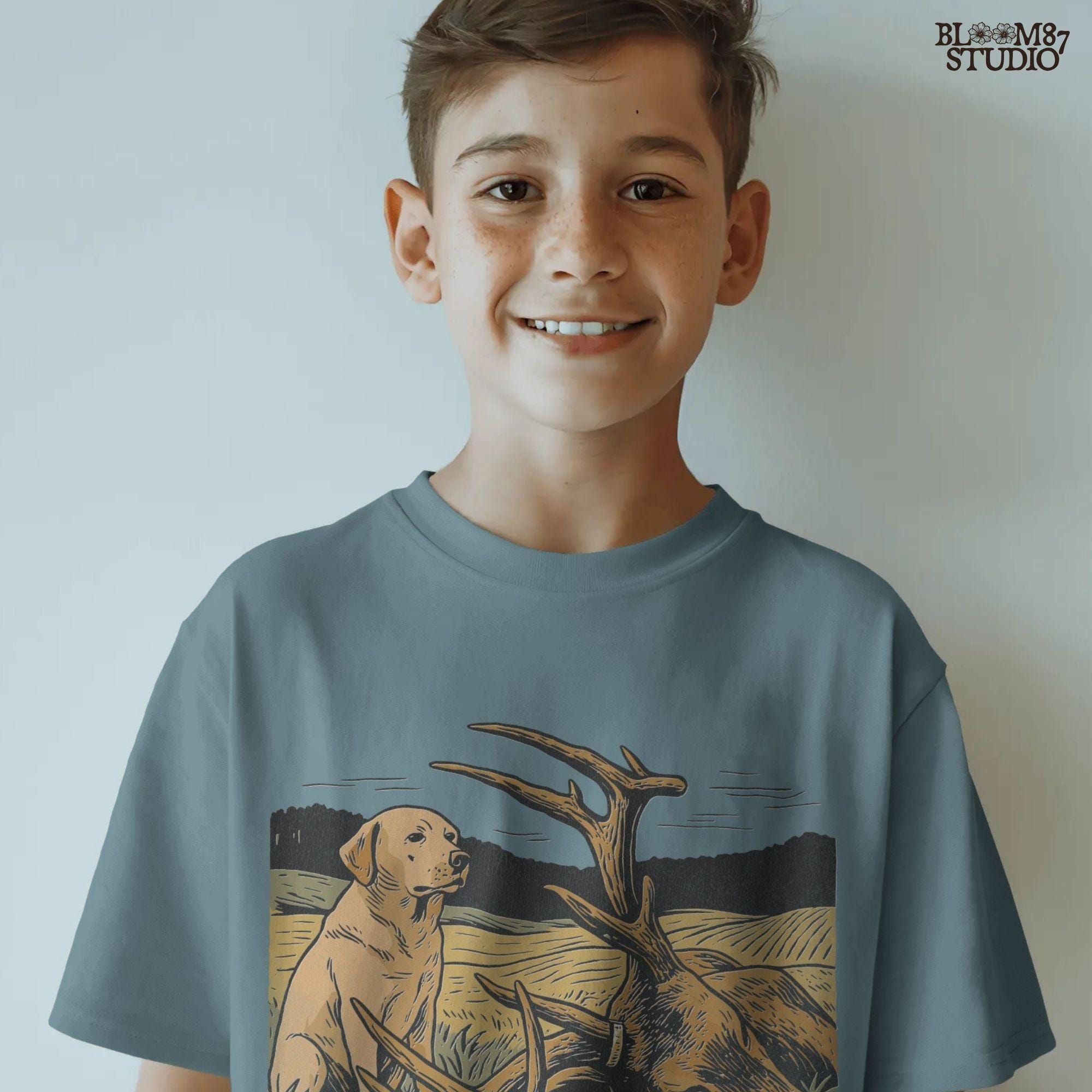 Rustic illustration of a Labrador Retriever sitting in a golden field beside a harvested deer with large antlers, PNG for hunting and lodge décor designs