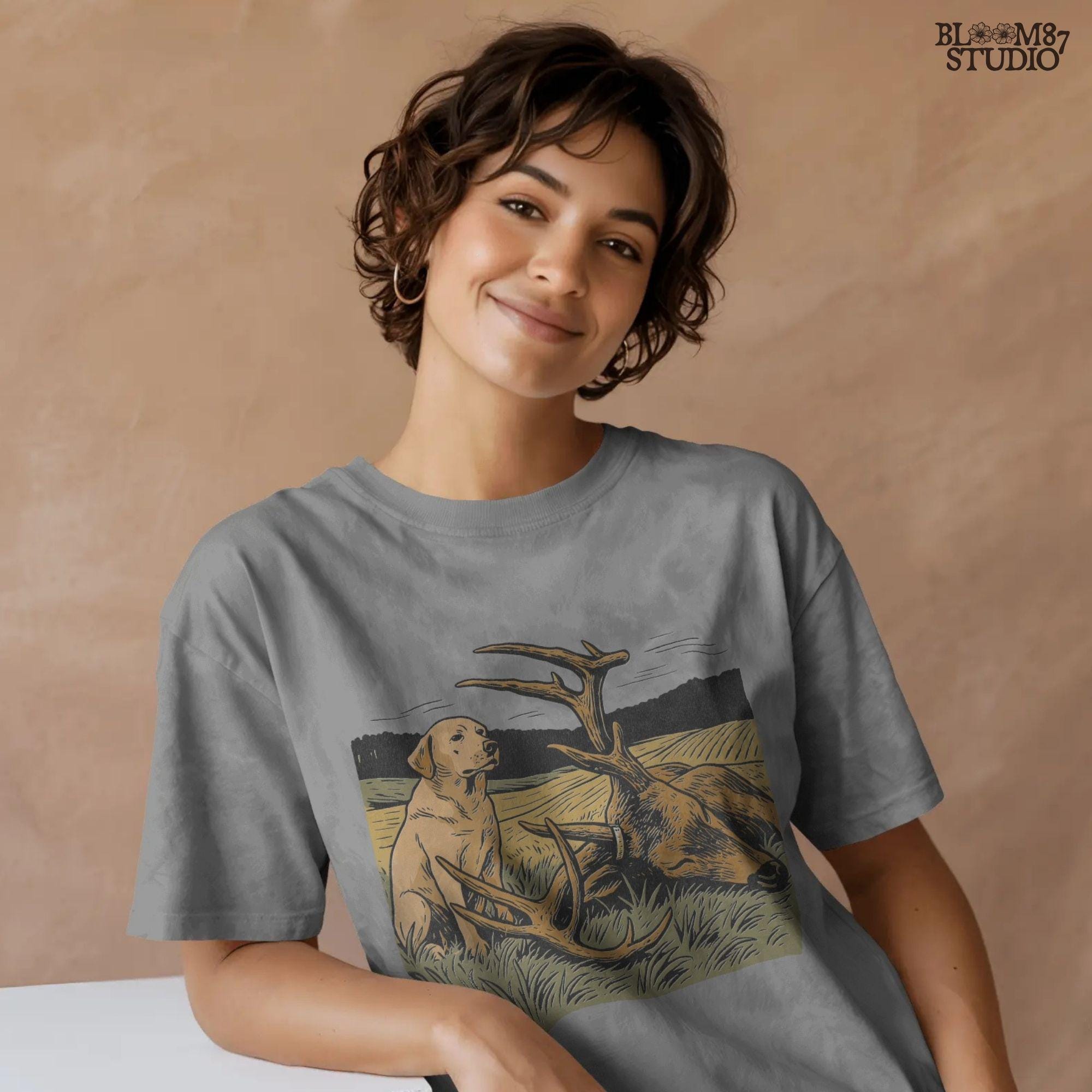 Rustic illustration of a Labrador Retriever sitting in a golden field beside a harvested deer with large antlers, PNG for hunting and lodge décor designs