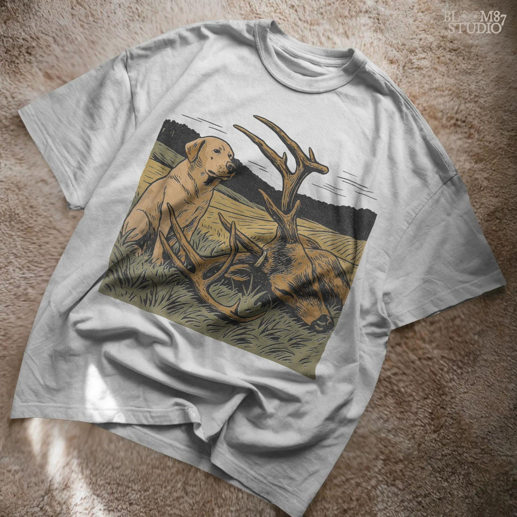 Rustic illustration of a Labrador Retriever sitting in a golden field beside a harvested deer with large antlers, PNG for hunting and lodge décor designs