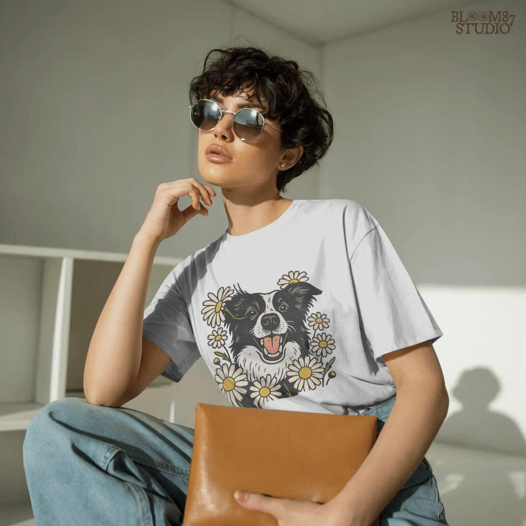 Happy Border Collie dog surrounded by white and yellow daisy flowers in a spring floral sublimation PNG design