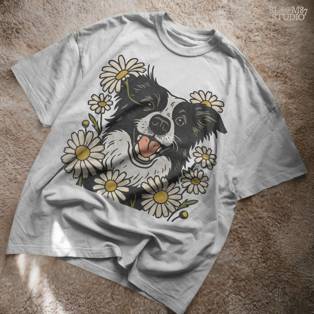 Happy Border Collie dog surrounded by white and yellow daisy flowers in a spring floral sublimation PNG design