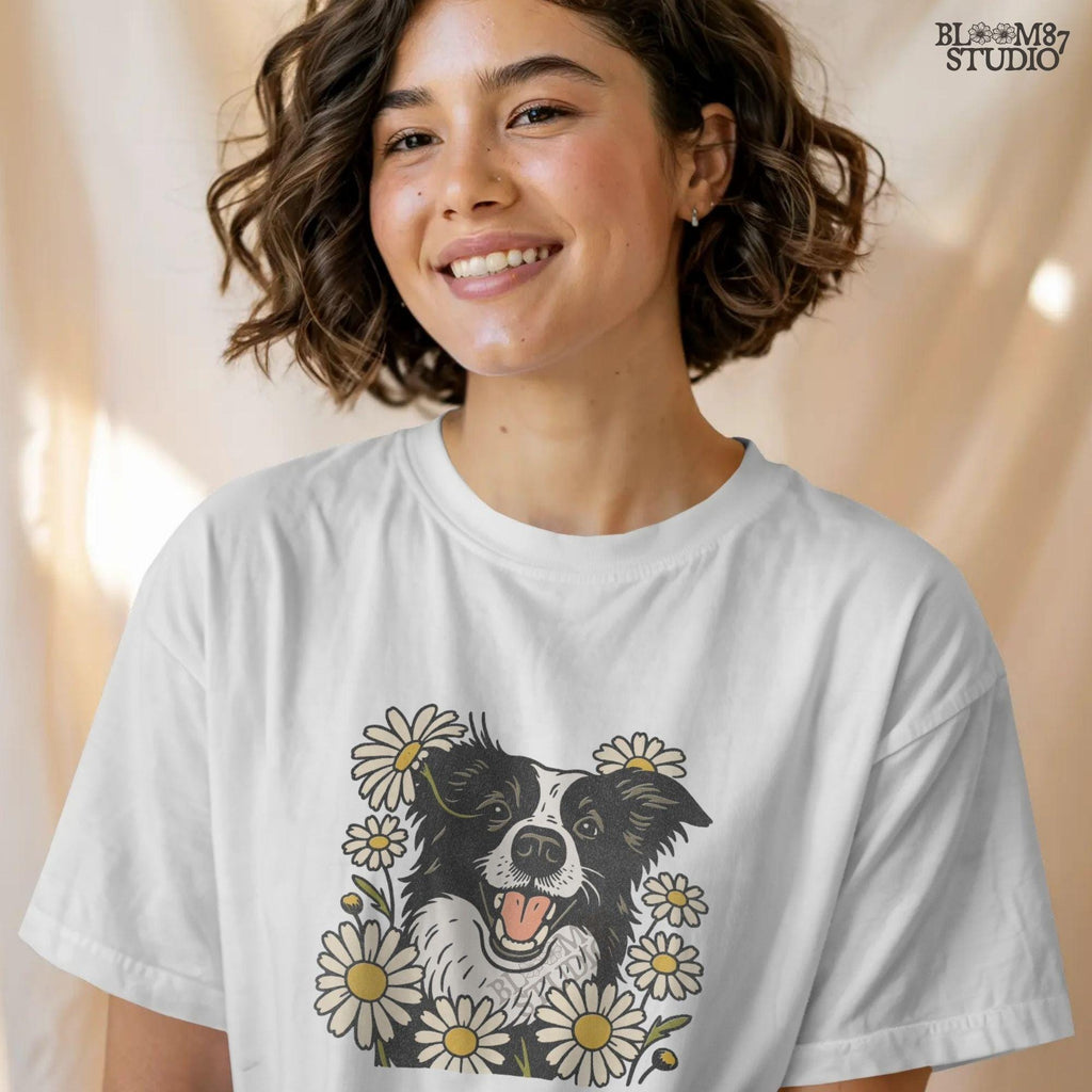 Happy Border Collie dog surrounded by white and yellow daisy flowers in a spring floral sublimation PNG design