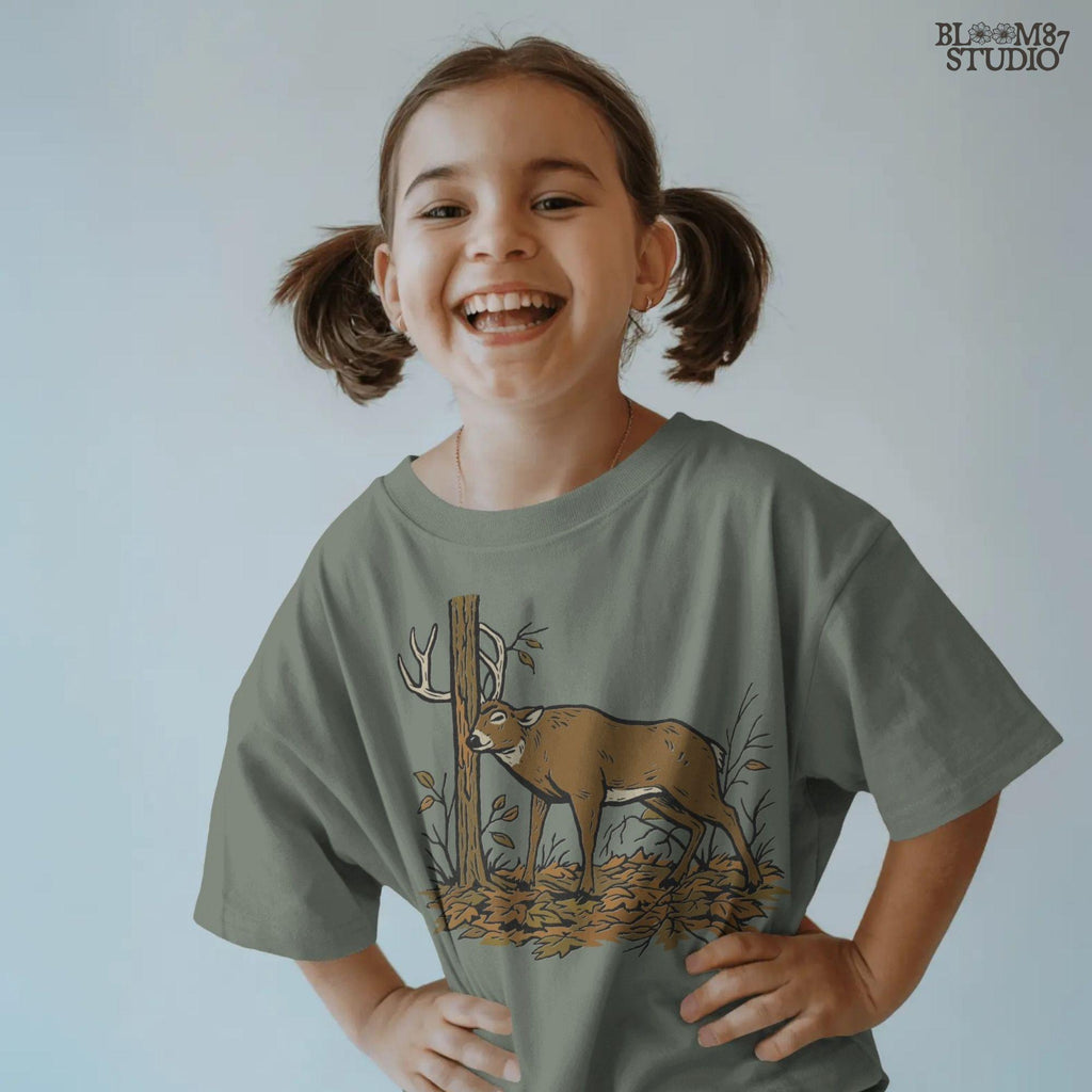 Illustration of a whitetail buck rubbing its antlers on a tree with autumn leaves on the ground, rustic hunting sublimation PNG design for shirts and décor