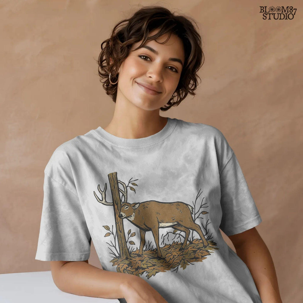 Illustration of a whitetail buck rubbing its antlers on a tree with autumn leaves on the ground, rustic hunting sublimation PNG design for shirts and décor