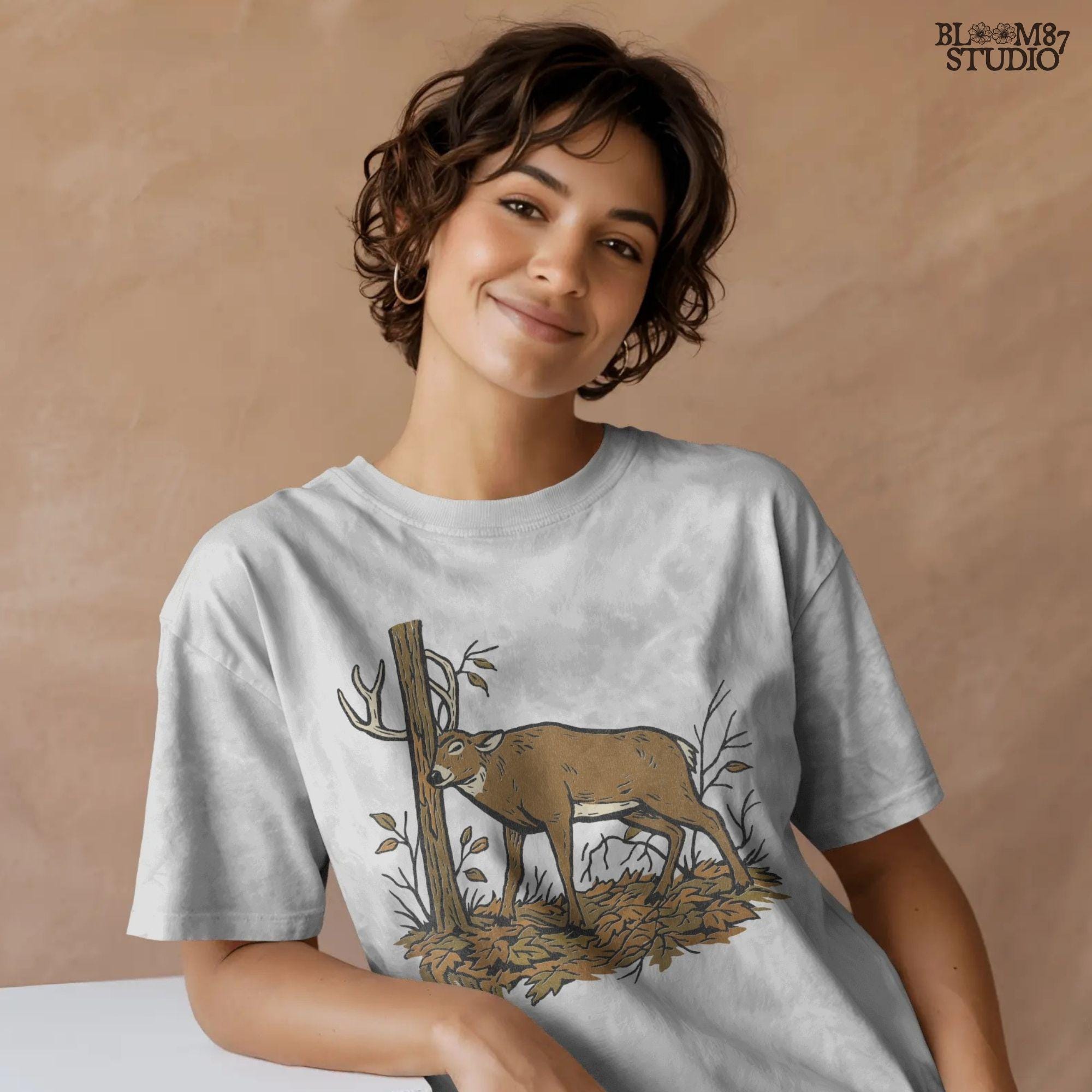 Illustration of a whitetail buck rubbing its antlers on a tree with autumn leaves on the ground, rustic hunting sublimation PNG design for shirts and décor