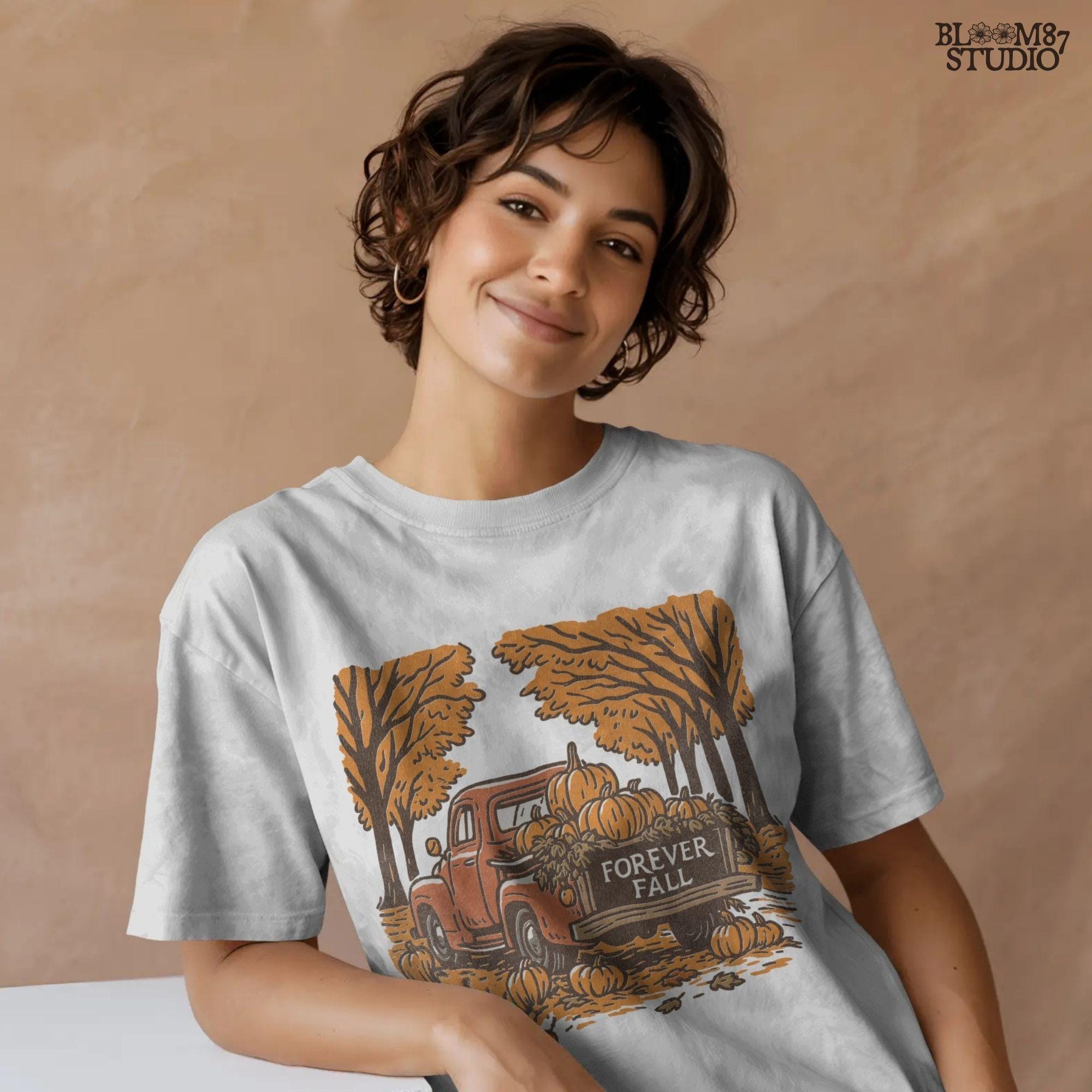 Illustration of a vintage red truck filled with pumpkins and the words “Forever Fall” on the tailgate, surrounded by autumn leaves and trees, sublimation PNG design.