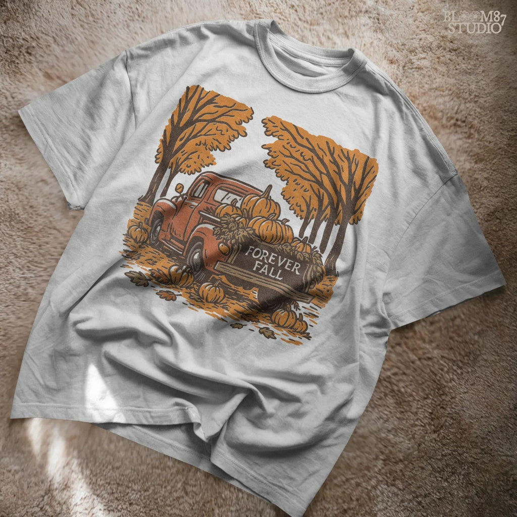 Illustration of a vintage red truck filled with pumpkins and the words “Forever Fall” on the tailgate, surrounded by autumn leaves and trees, sublimation PNG design.