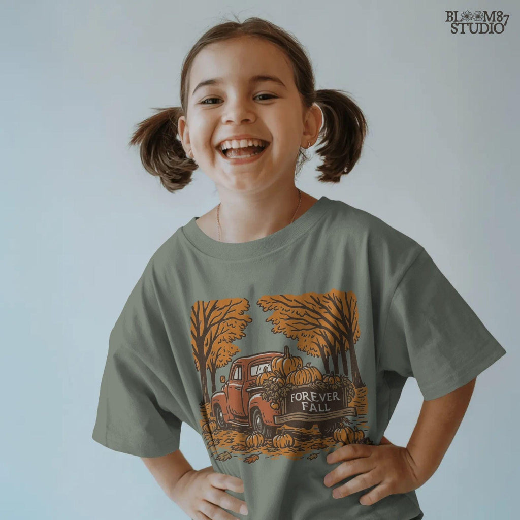 Illustration of a vintage red truck filled with pumpkins and the words “Forever Fall” on the tailgate, surrounded by autumn leaves and trees, sublimation PNG design.