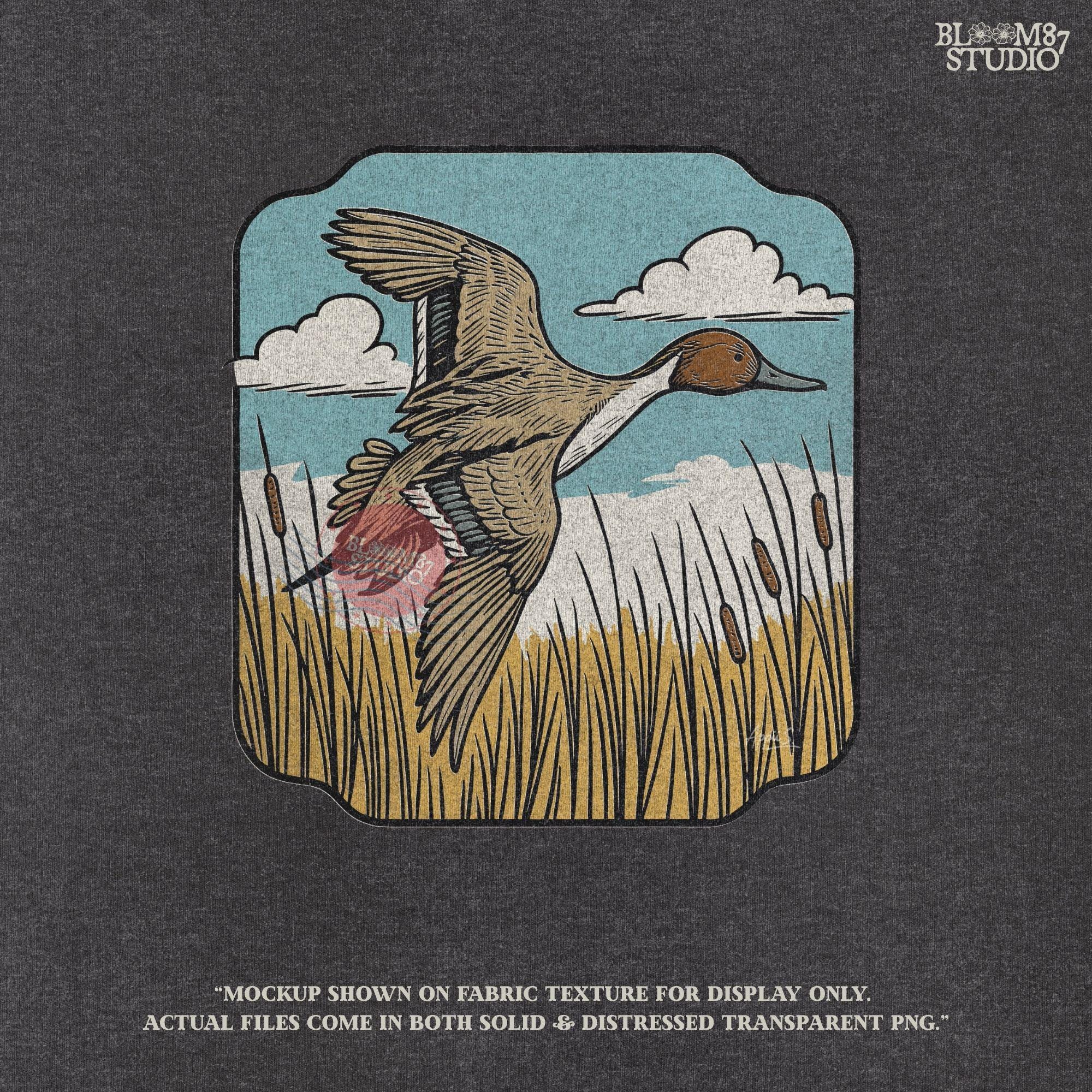 Illustration of a pintail duck flying above cattails with a blue sky and clouds, rustic waterfowl hunting sublimation PNG design.