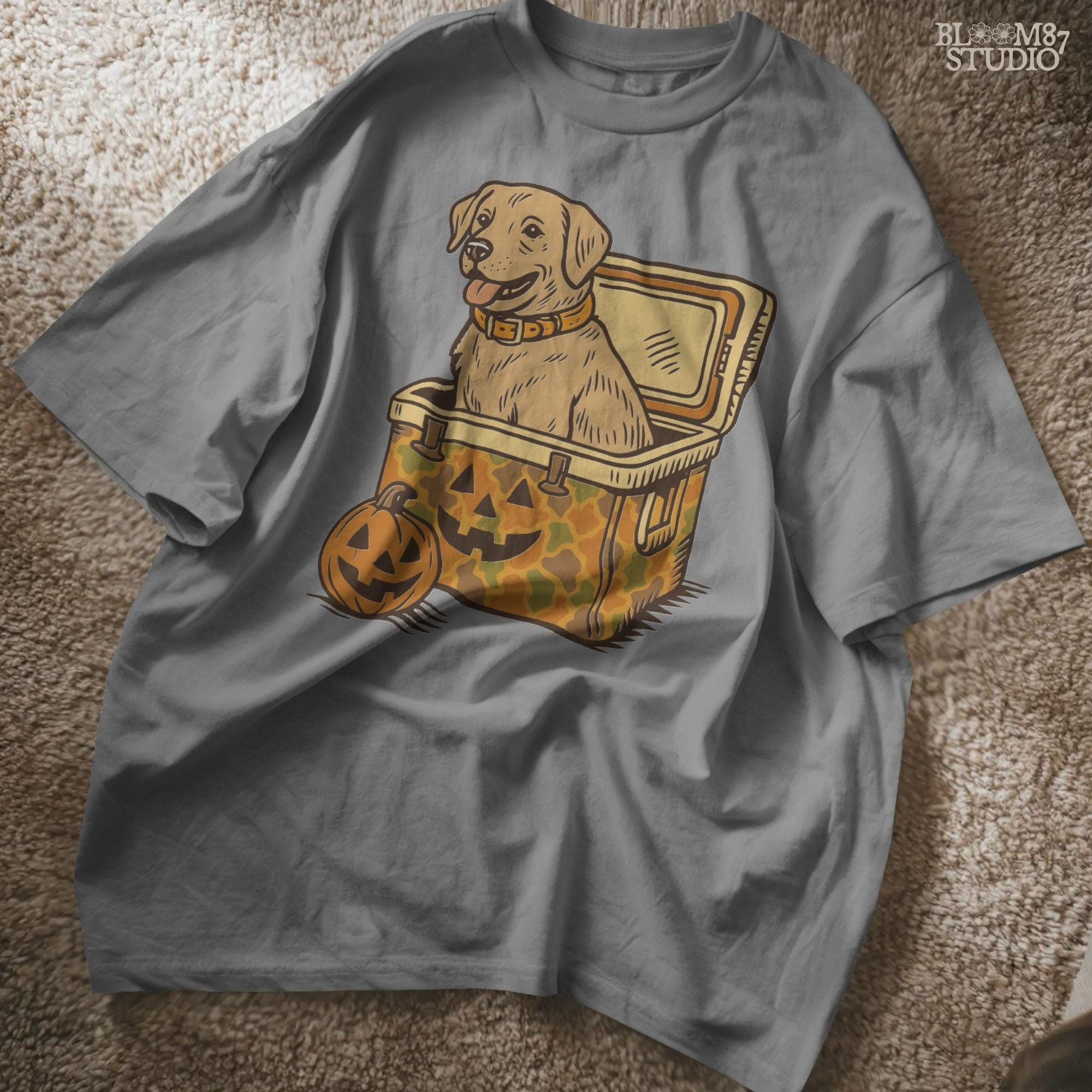 Halloween-themed yellow Labrador retriever sitting inside a pumpkin camo cooler with jack-o’-lanterns, sublimation PNG graphic.