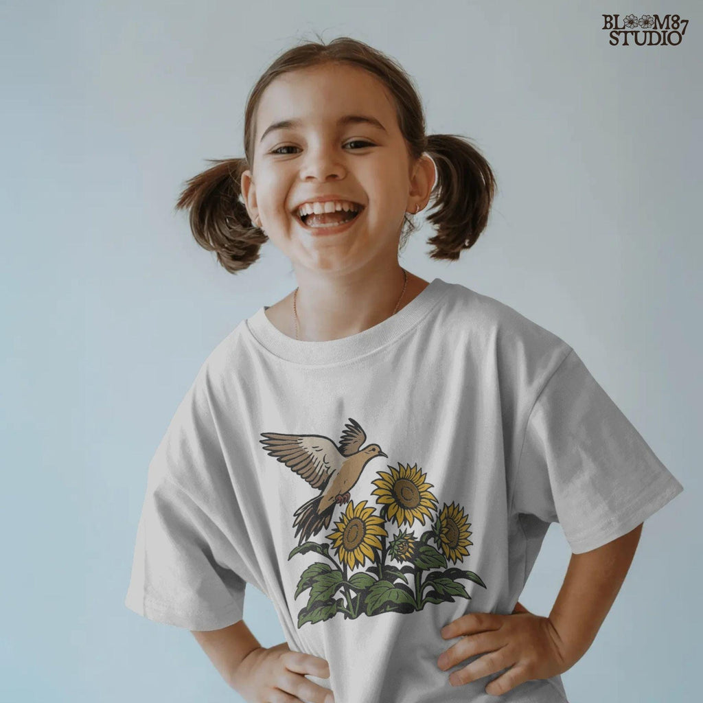 Mourning dove flying above blooming sunflowers with green leaves. Rustic sublimation PNG design for fall and country-themed crafts.