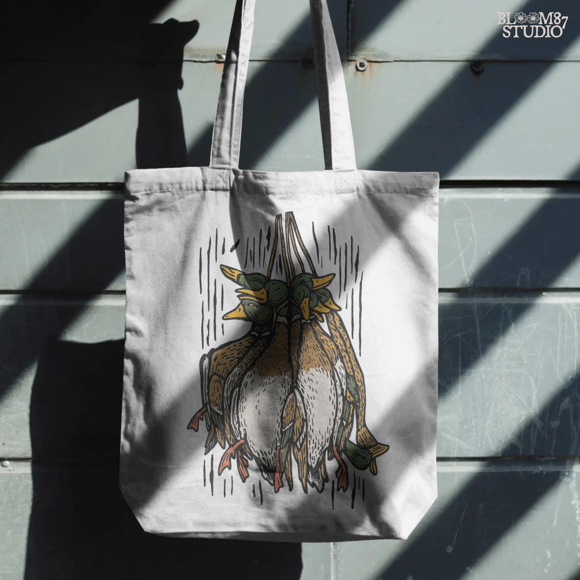 Illustration of harvested mallard ducks hanging together, rustic hunting sublimation PNG design for duck hunters, outdoor gifts, and lodge artwork.