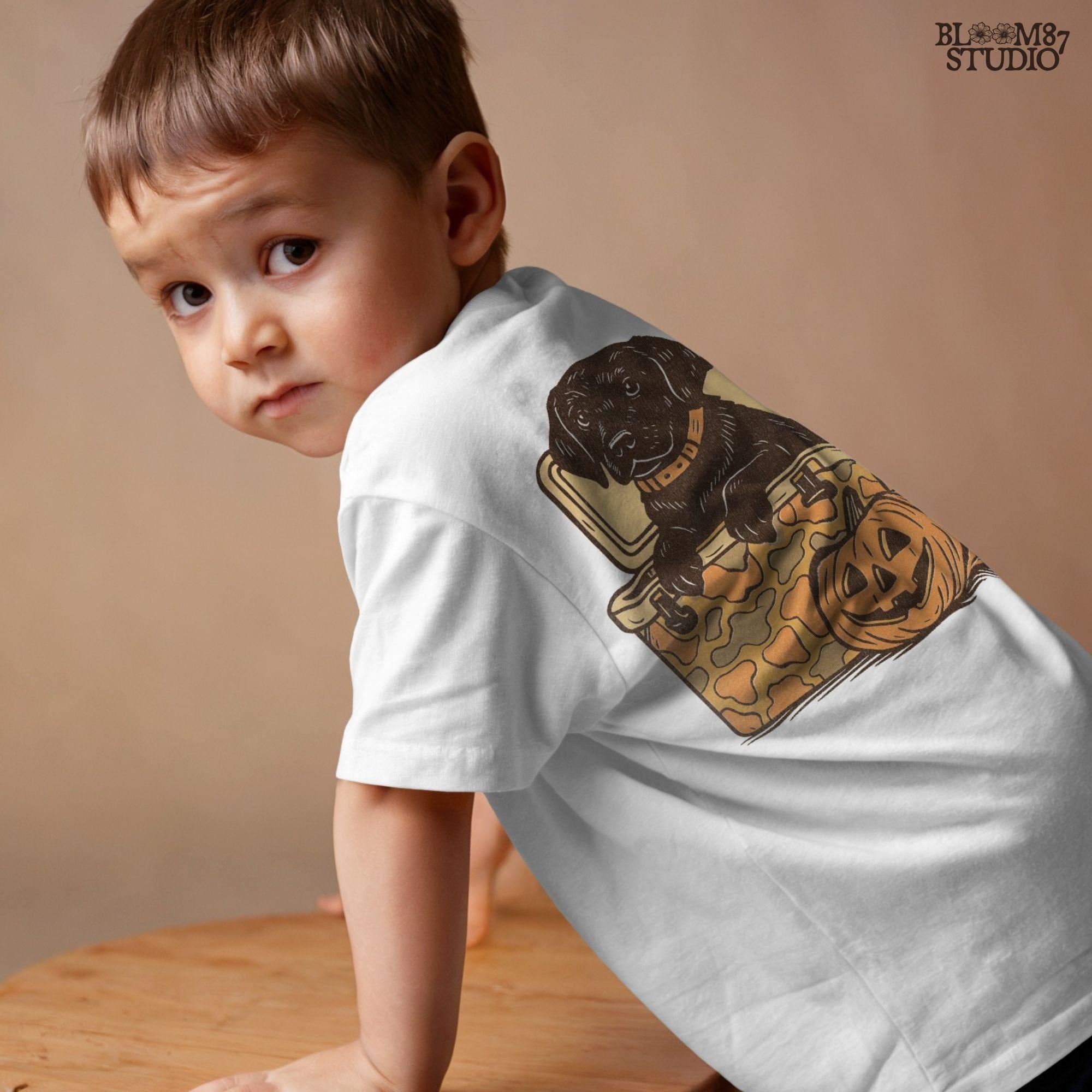 Black Labrador retriever sitting in a cooler with a pumpkin, Halloween sublimation PNG design for dog lovers, seasonal crafts, and apparel.