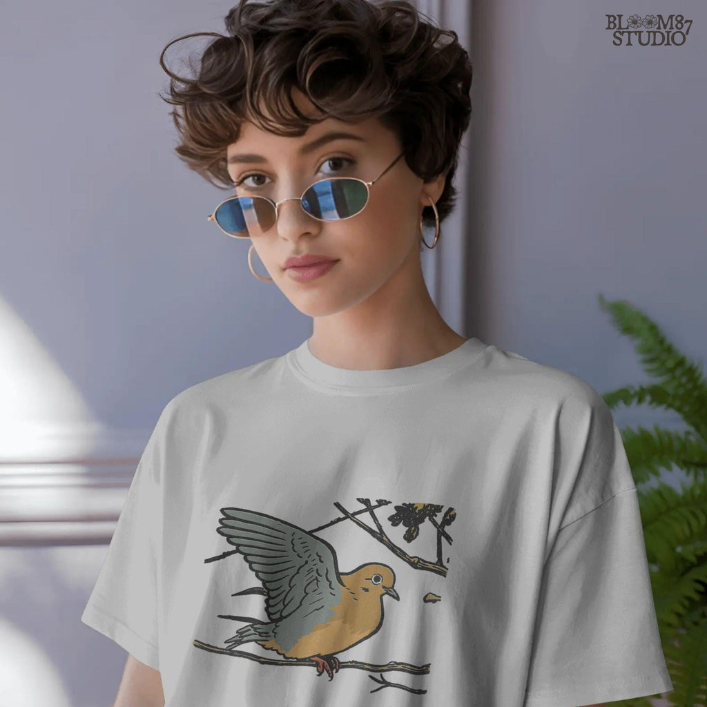 Rustic sublimation PNG of a mourning dove perched on a tree branch, ideal for hunting-themed or fall wildlife shirt designs.