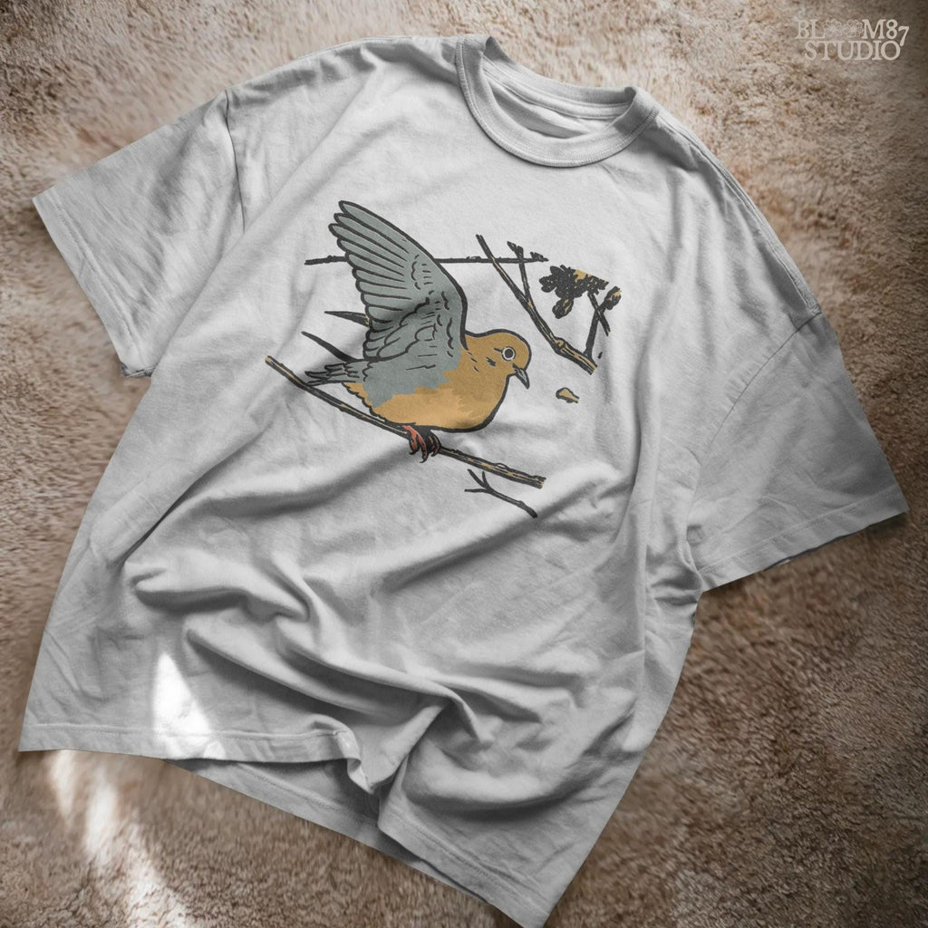 Rustic sublimation PNG of a mourning dove perched on a tree branch, ideal for hunting-themed or fall wildlife shirt designs.