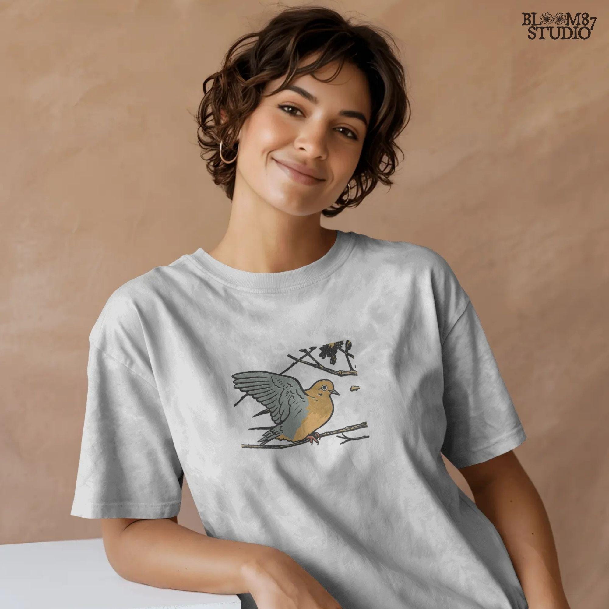Rustic sublimation PNG of a mourning dove perched on a tree branch, ideal for hunting-themed or fall wildlife shirt designs.