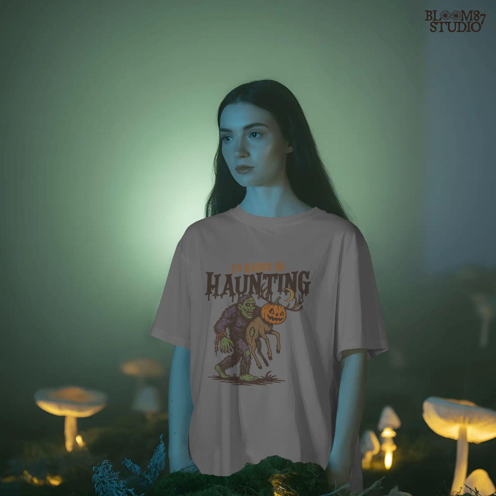 Humorous Halloween sublimation PNG featuring a zombie carrying a deer with a jack-o’-lantern head and the phrase “I’d Rather Be Haunting.”