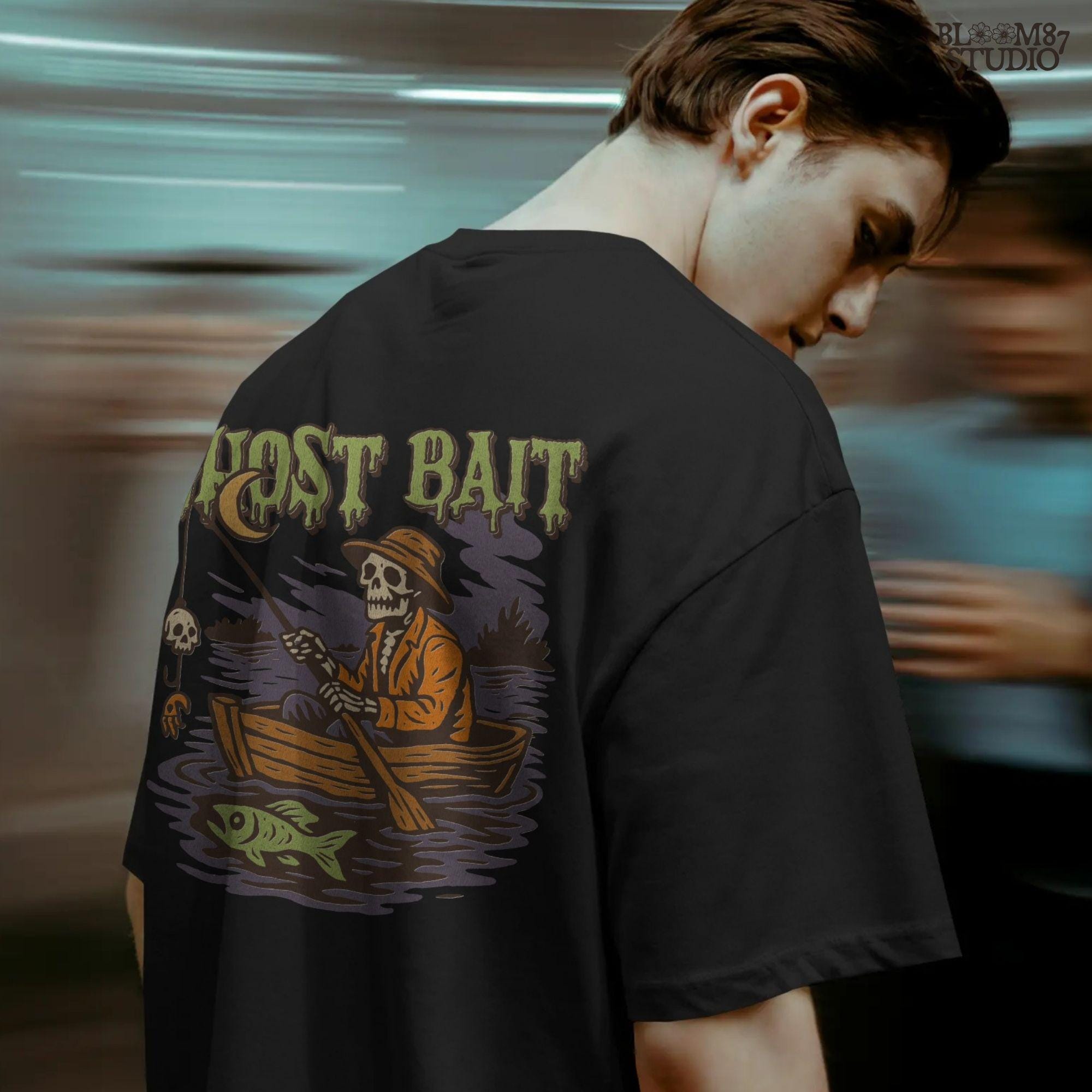 Funny Halloween PNG design of a skeleton fisherman in a wooden boat with a skull as bait and a ghostly fish, titled “Ghost Bait”.