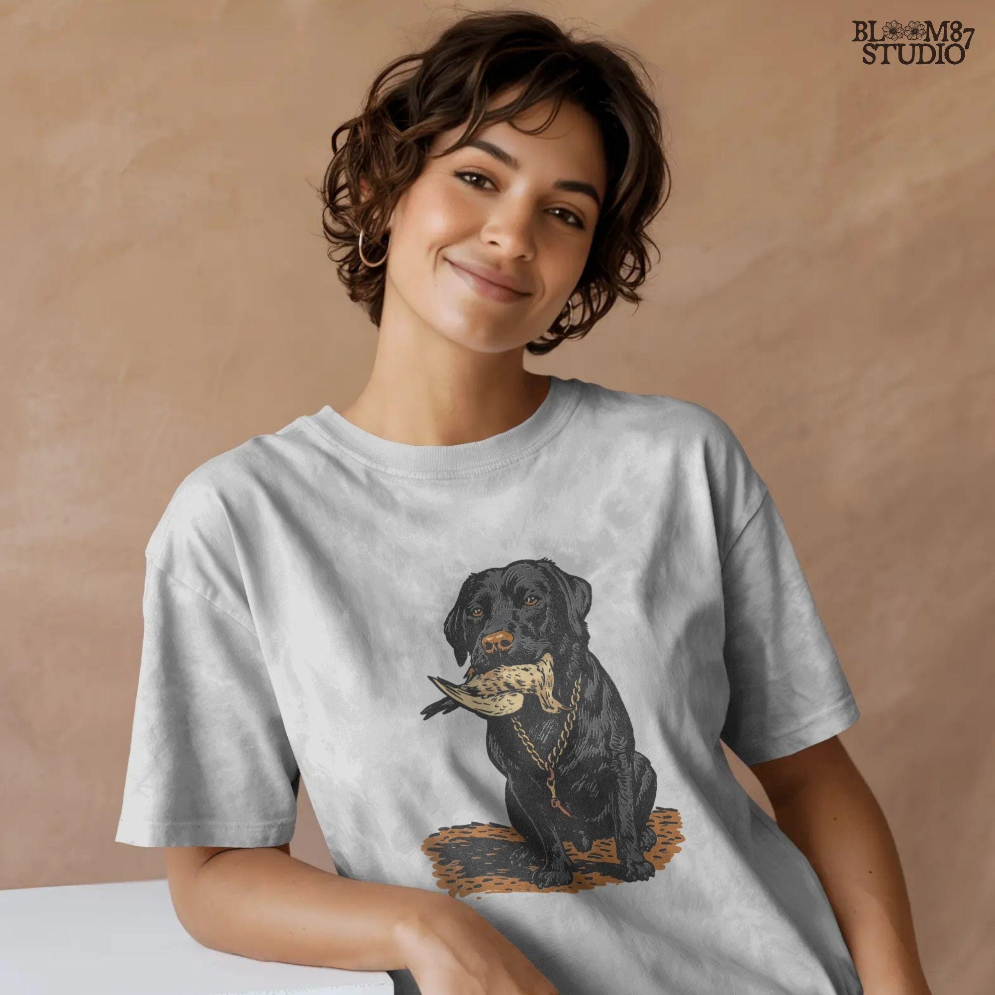 Black Labrador retriever sitting with a dove in its mouth, illustrated for dove hunting sublimation projects and bird dog gift designs.