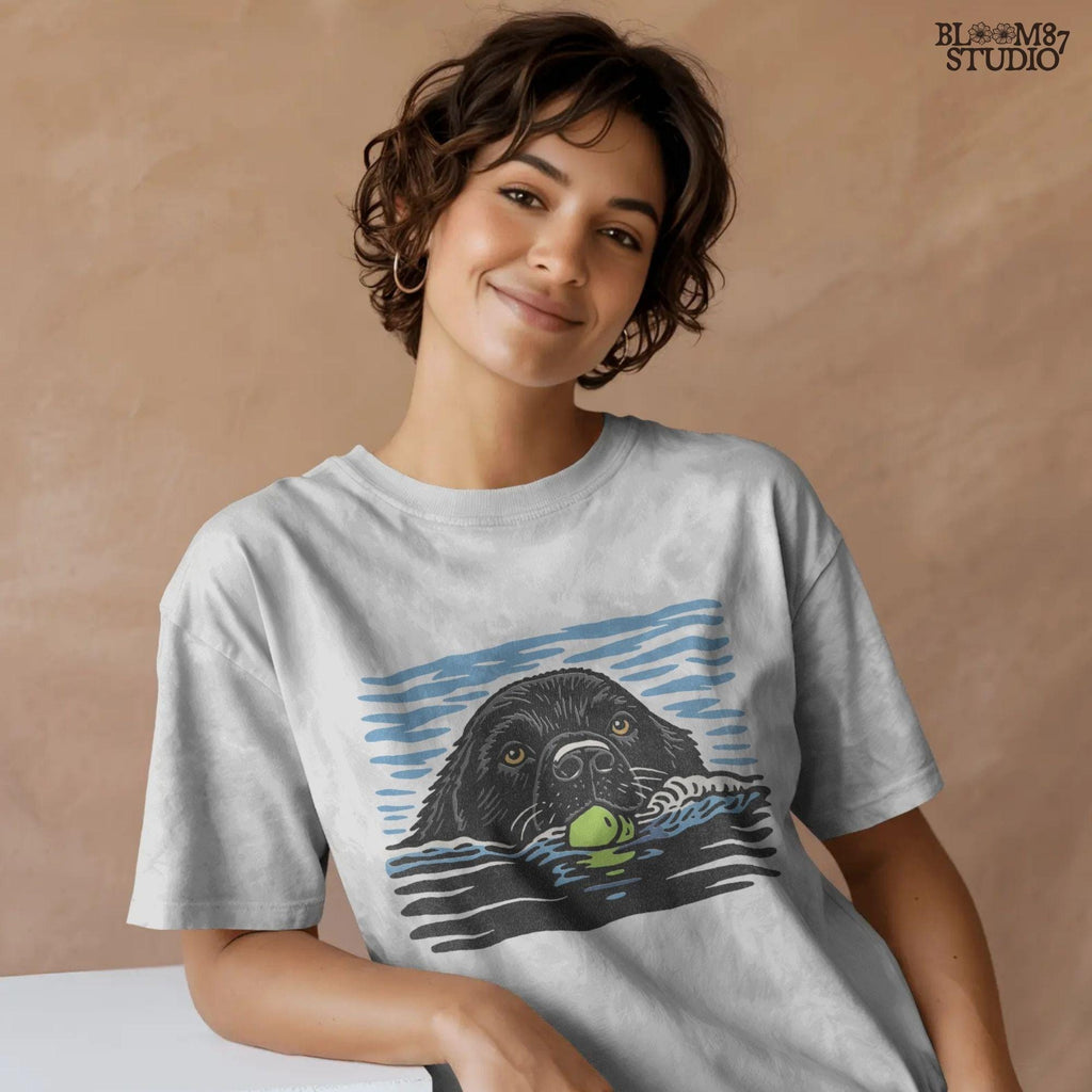 Black Labrador retriever swimming in water while holding a green tennis ball, drawn in vintage style for sublimation and dog lover projects.