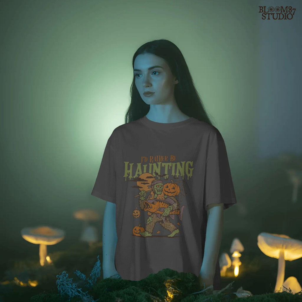 Zombie fisherman walking with a giant bass fish and jack-o’-lanterns, surrounded by bats and full moon, Halloween-themed sublimation clipart.