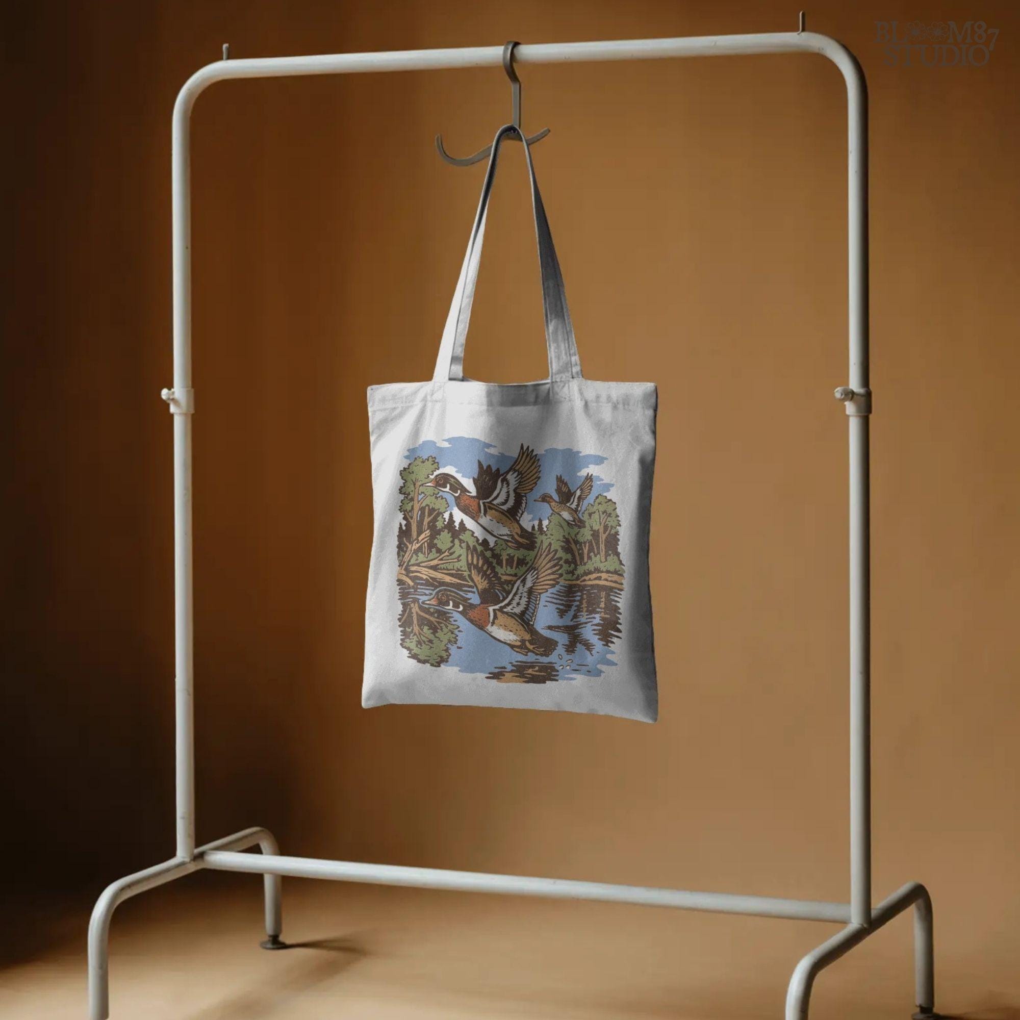 Vintage wood duck artwork showing ducks flying over a calm forest lake, perfect for fall hunting-themed sublimation designs and rustic crafts.