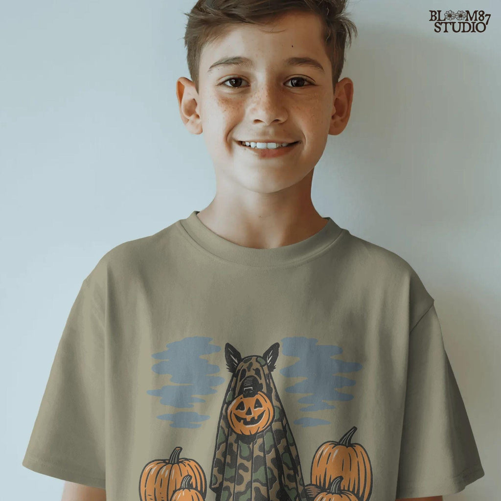 German Shepherd in camouflage ghost costume with jack-o’-lantern head surrounded by pumpkins, Halloween-themed sublimation design