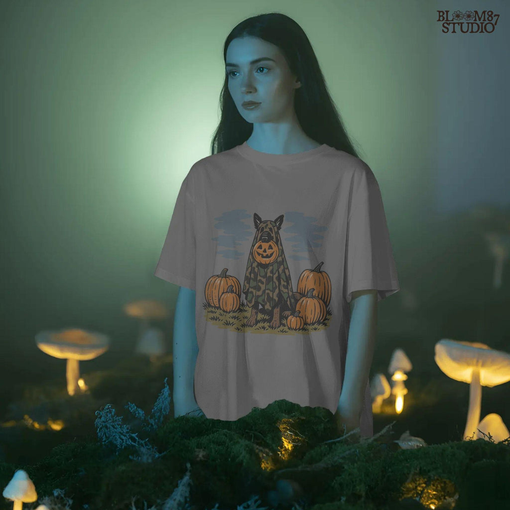 German Shepherd in camouflage ghost costume with jack-o’-lantern head surrounded by pumpkins, Halloween-themed sublimation design