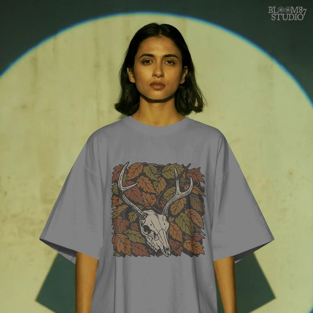 Deer skull with antlers surrounded by autumn leaves, rustic fall hunting sublimation PNG design.