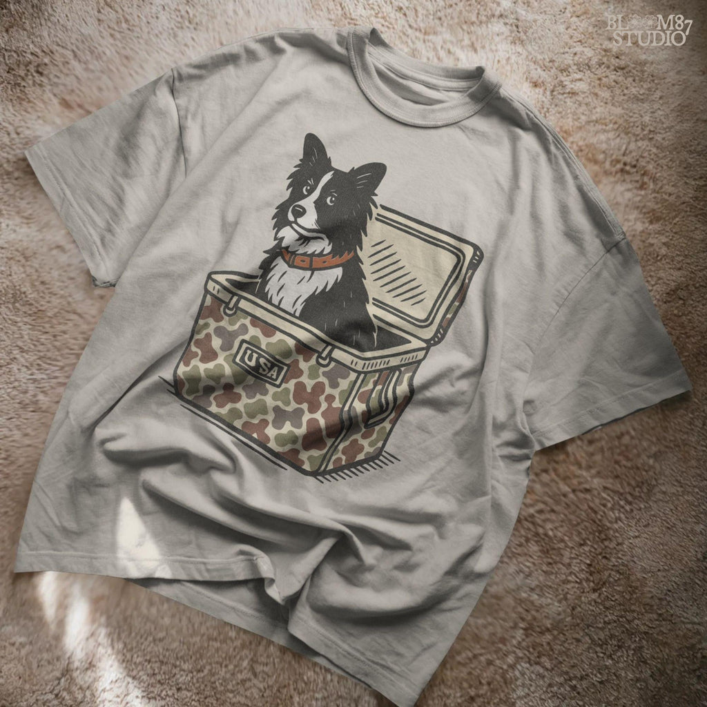 Illustration of a Border Collie sitting inside a camouflage cooler labeled “USA,” rustic farm and ranch-themed sublimation PNG design