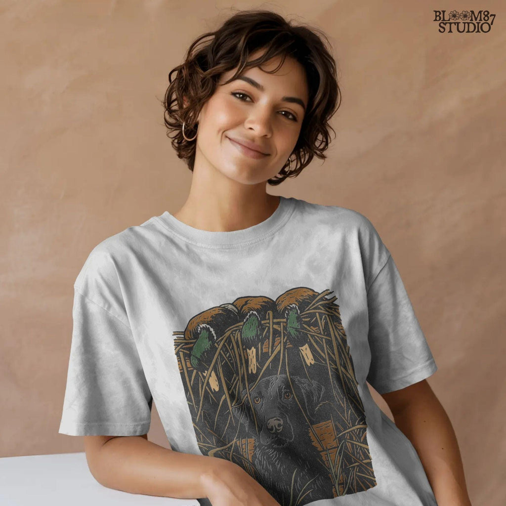 Illustration of a black Labrador retriever sitting in marsh grass beneath three mallard ducks, ideal for duck hunting and lodge décor sublimation designs