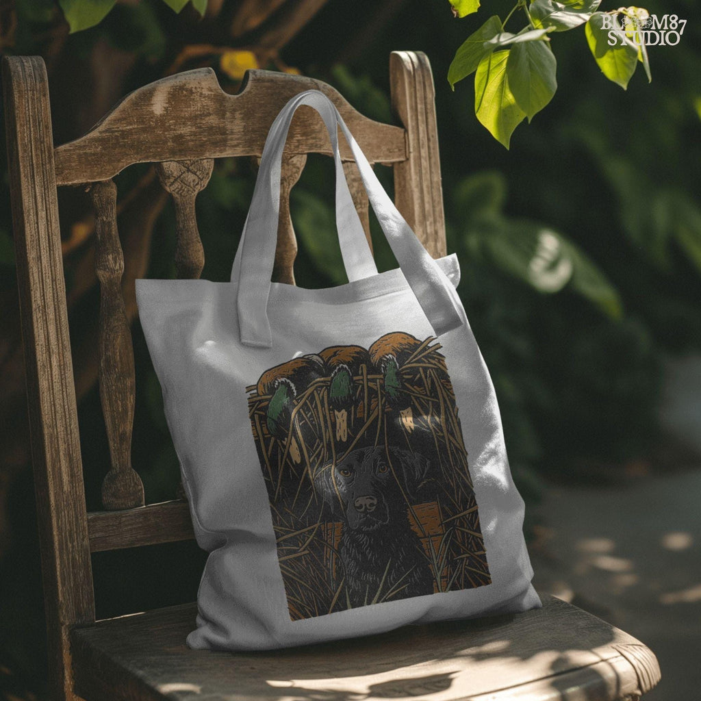 Illustration of a black Labrador retriever sitting in marsh grass beneath three mallard ducks, ideal for duck hunting and lodge décor sublimation designs