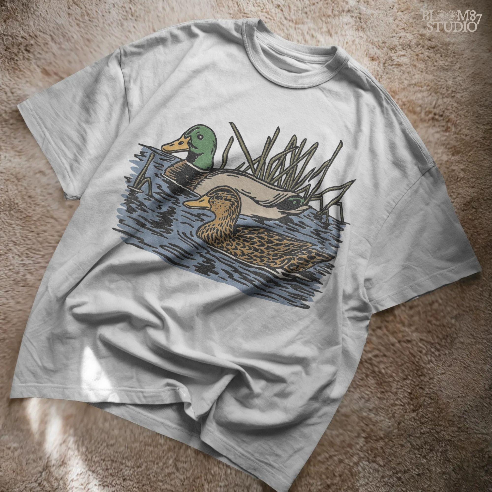 Illustration of a male and female mallard duck swimming in marsh water among reeds, ideal for waterfowl hunting and lodge décor sublimation designs