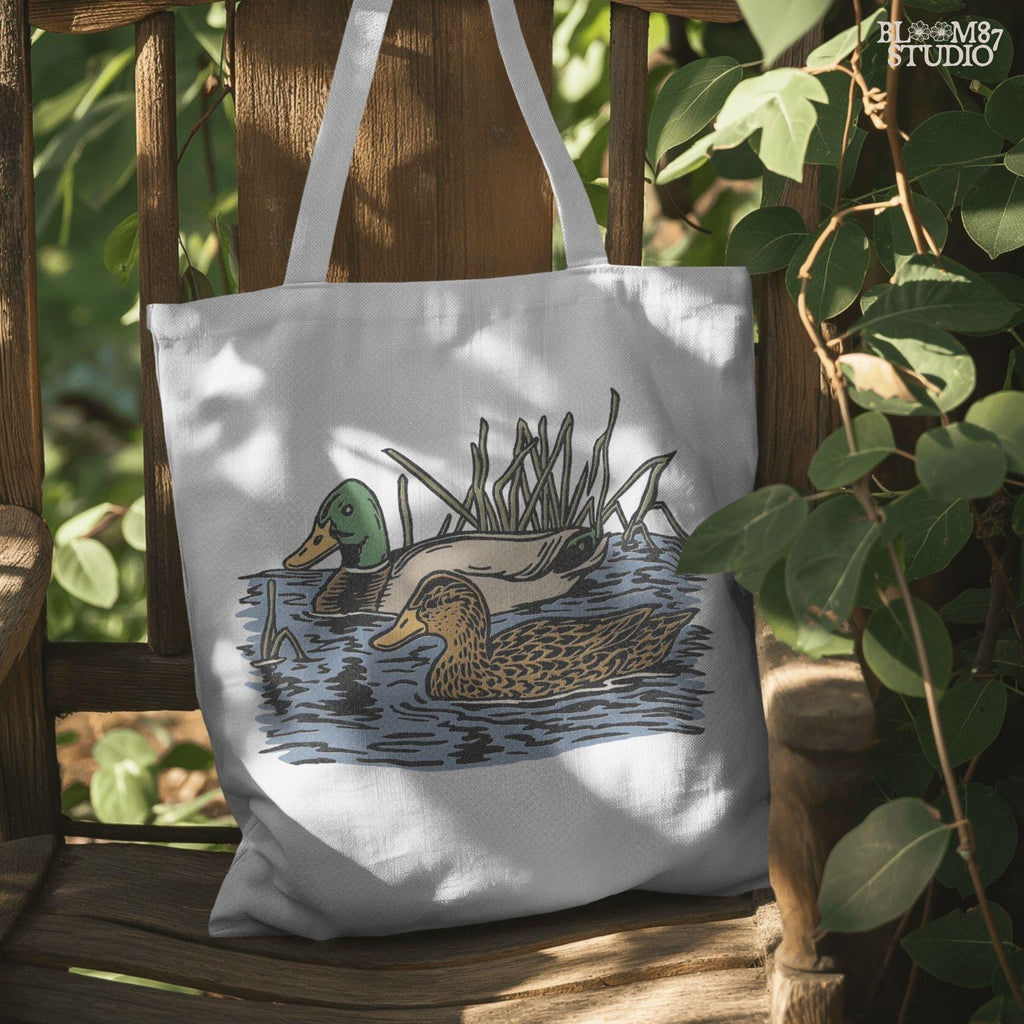 Illustration of a male and female mallard duck swimming in marsh water among reeds, ideal for waterfowl hunting and lodge décor sublimation designs