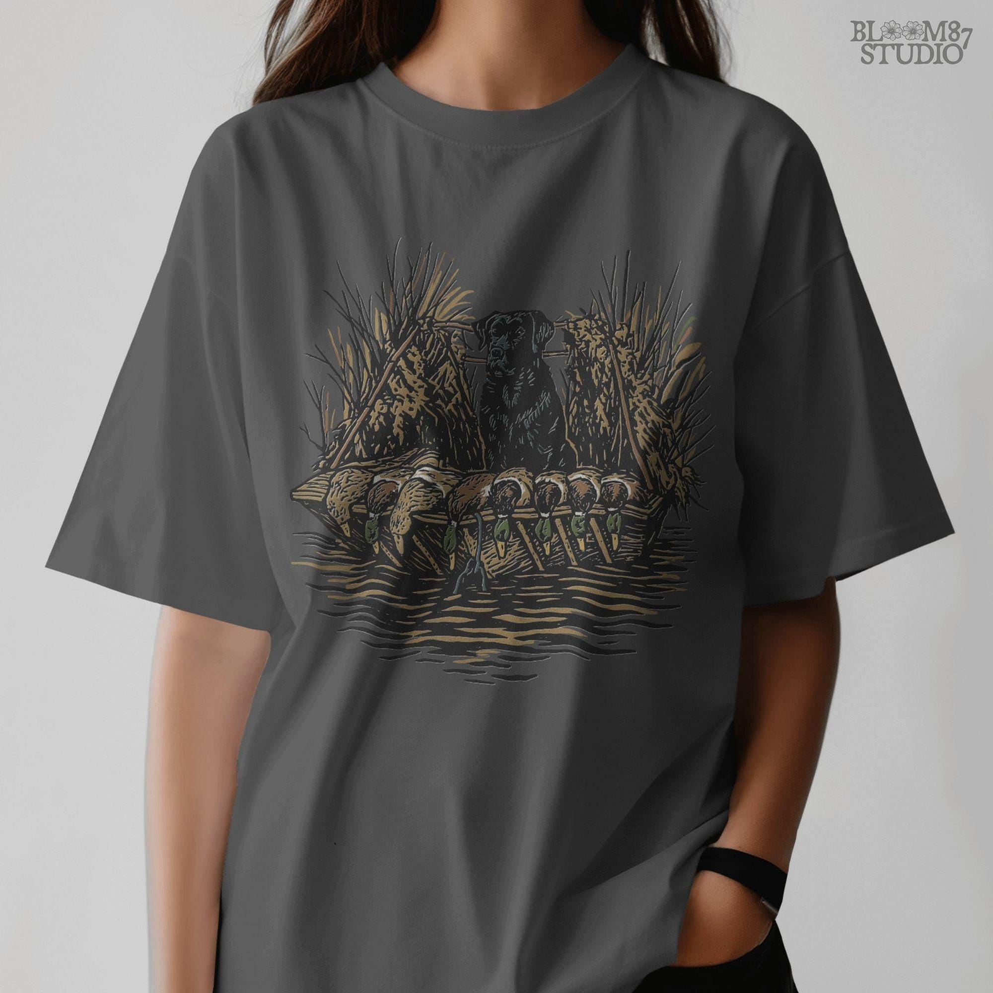 Black hunting retriever dog sitting in a duck blind with harvested mallards, rustic waterfowl hunting sublimation PNG design.