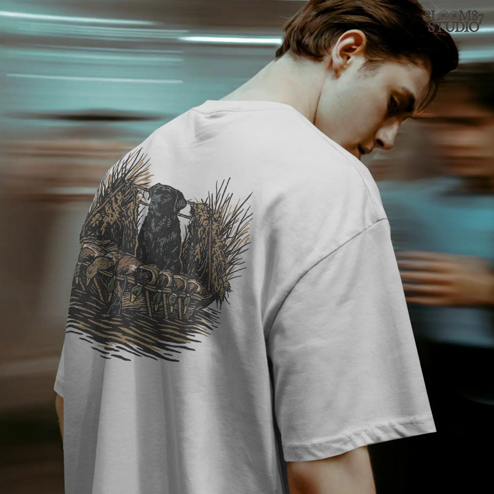 Black hunting retriever dog sitting in a duck blind with harvested mallards, rustic waterfowl hunting sublimation PNG design.