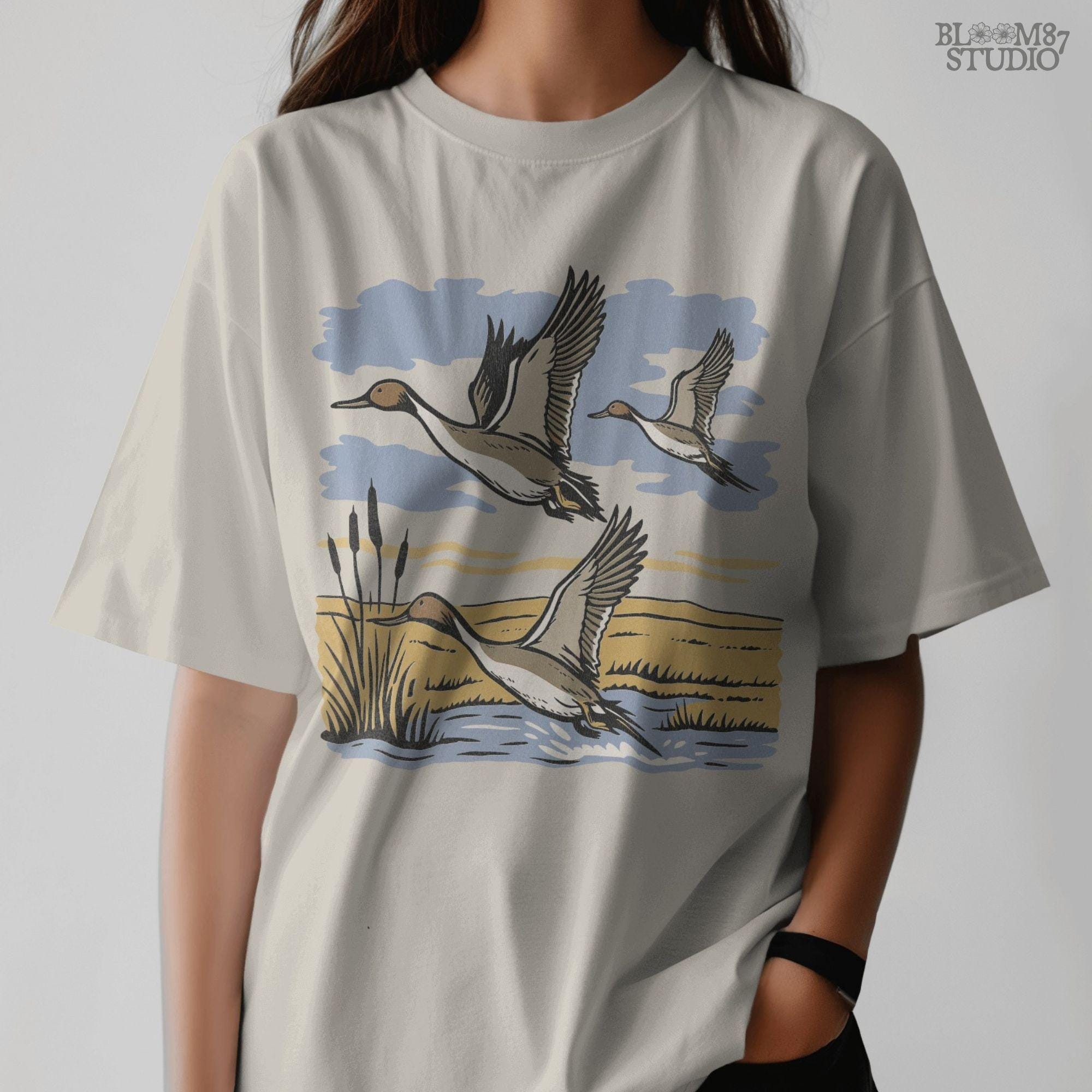 Rustic illustration of pintail ducks flying over wetlands, detailed waterfowl PNG for sublimation, hunting crafts, and wildlife decor.