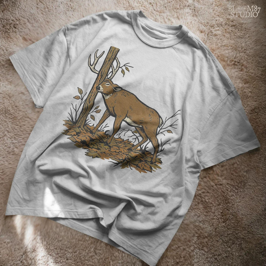 Illustration of a whitetail buck rubbing its antlers on a tree with autumn leaves on the ground, rustic hunting sublimation PNG design for shirts and décor