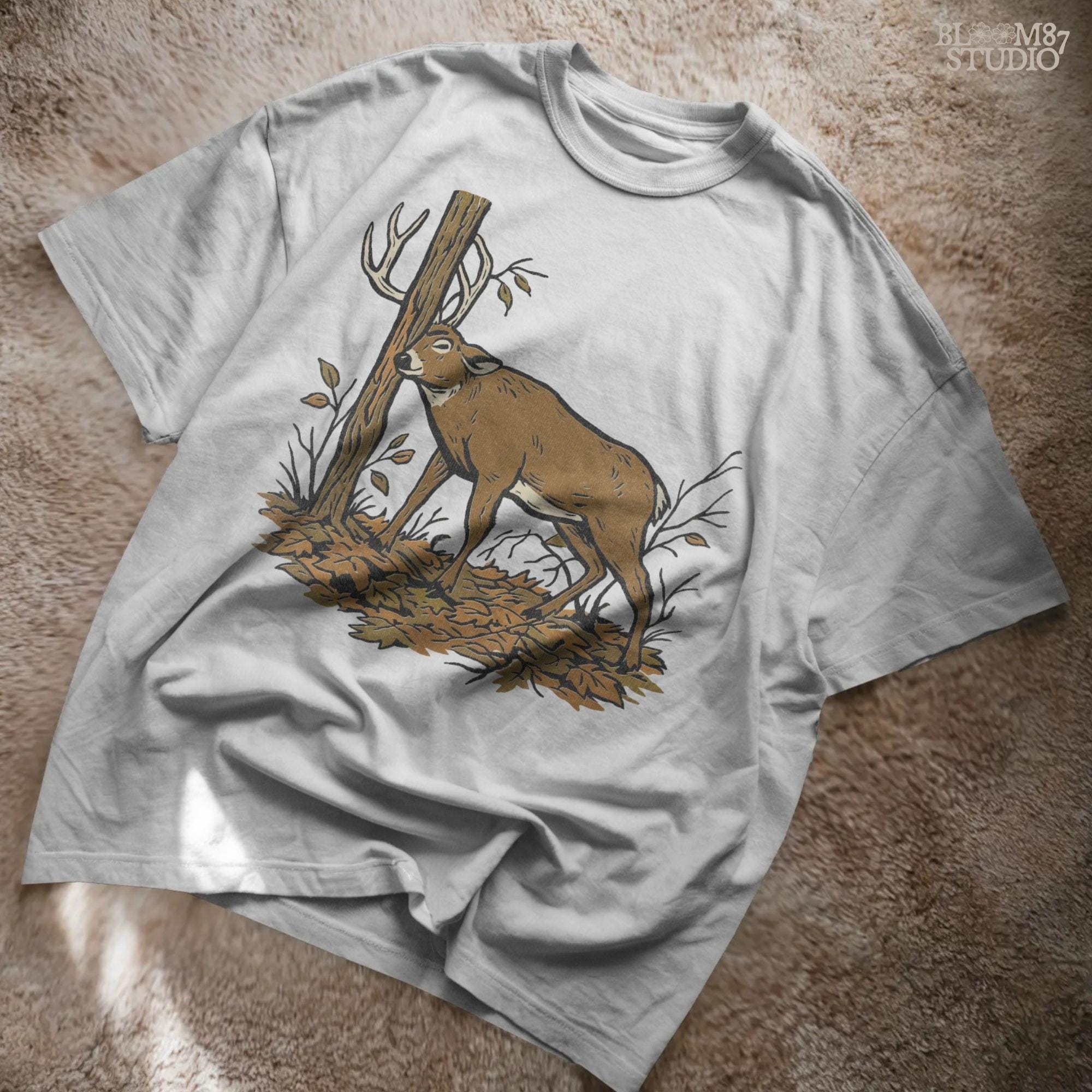 Illustration of a whitetail buck rubbing its antlers on a tree with autumn leaves on the ground, rustic hunting sublimation PNG design for shirts and décor