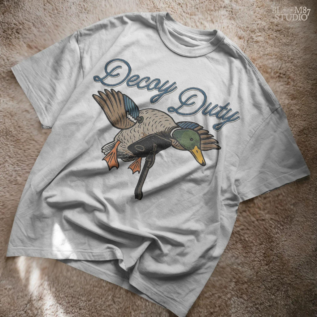 Illustration of a mallard duck hunting decoy with the words “Decoy Duty,” rustic sublimation PNG design for hunters and outdoor artwork.