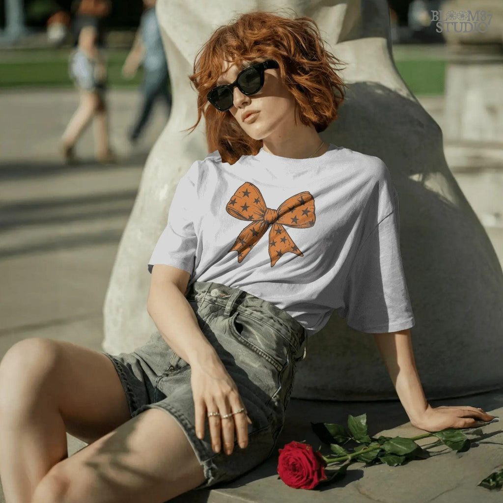 Solid version: "Orange Halloween bow with black star pattern, sublimation PNG ribbon clipart, solid version"

Distressed version: "Halloween bow sublimation PNG with orange star ribbon, vintage distressed textured style"