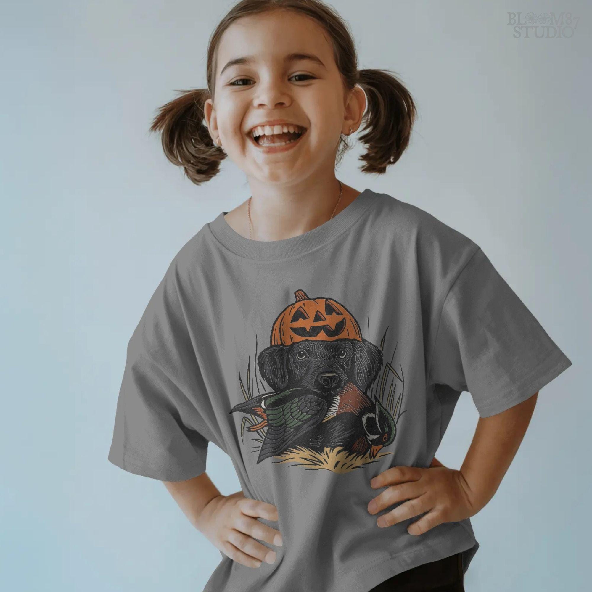 Solid version: "Black Labrador wearing pumpkin jack o lantern hat holding duck, Halloween hunting dog sublimation PNG solid style"

Distressed version: "Halloween hunting dog with pumpkin hat and duck, black lab sublimation PNG vintage distressed version"