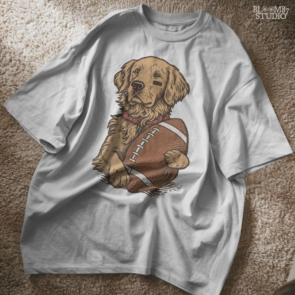 Illustration of a golden retriever holding a football, cute sports dog sublimation PNG for game day shirts, tailgate party designs, and pet lover gifts.