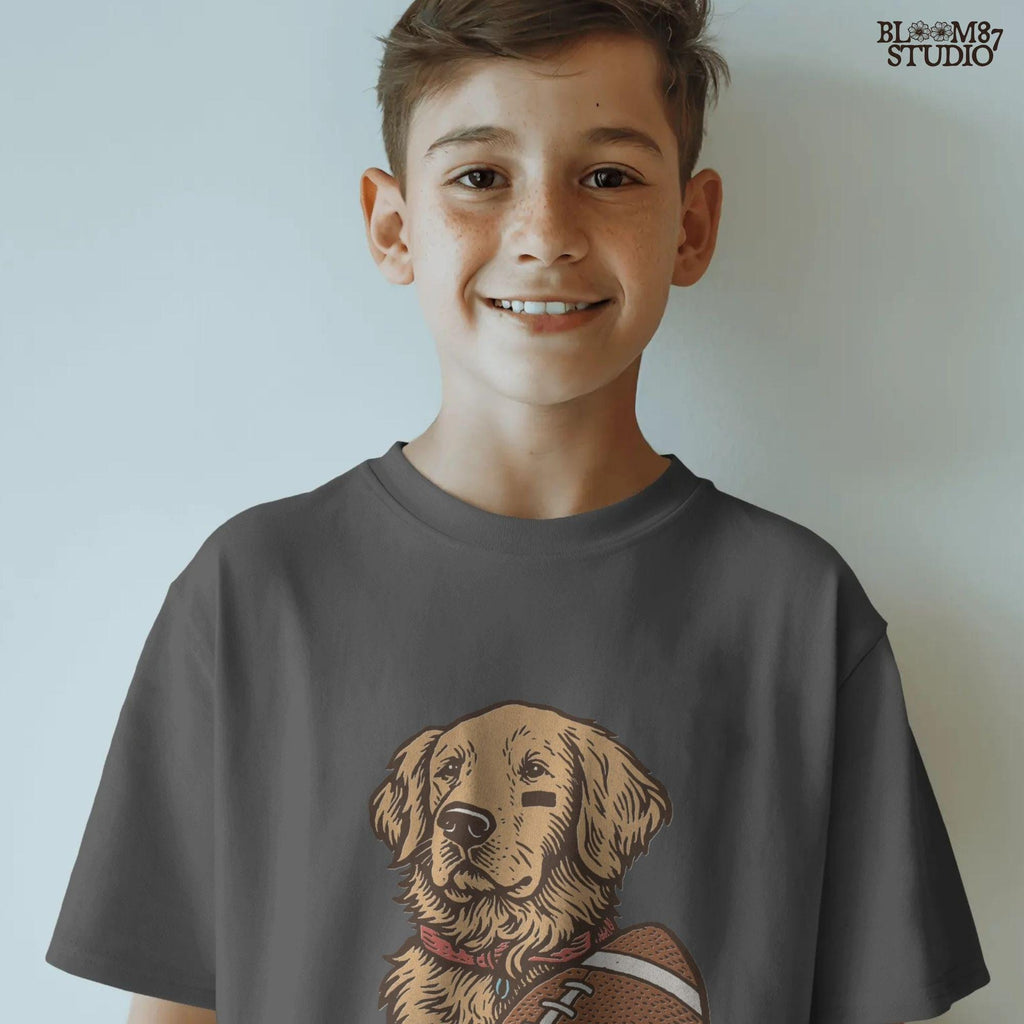 Illustration of a golden retriever holding a football, cute sports dog sublimation PNG for game day shirts, tailgate party designs, and pet lover gifts.
