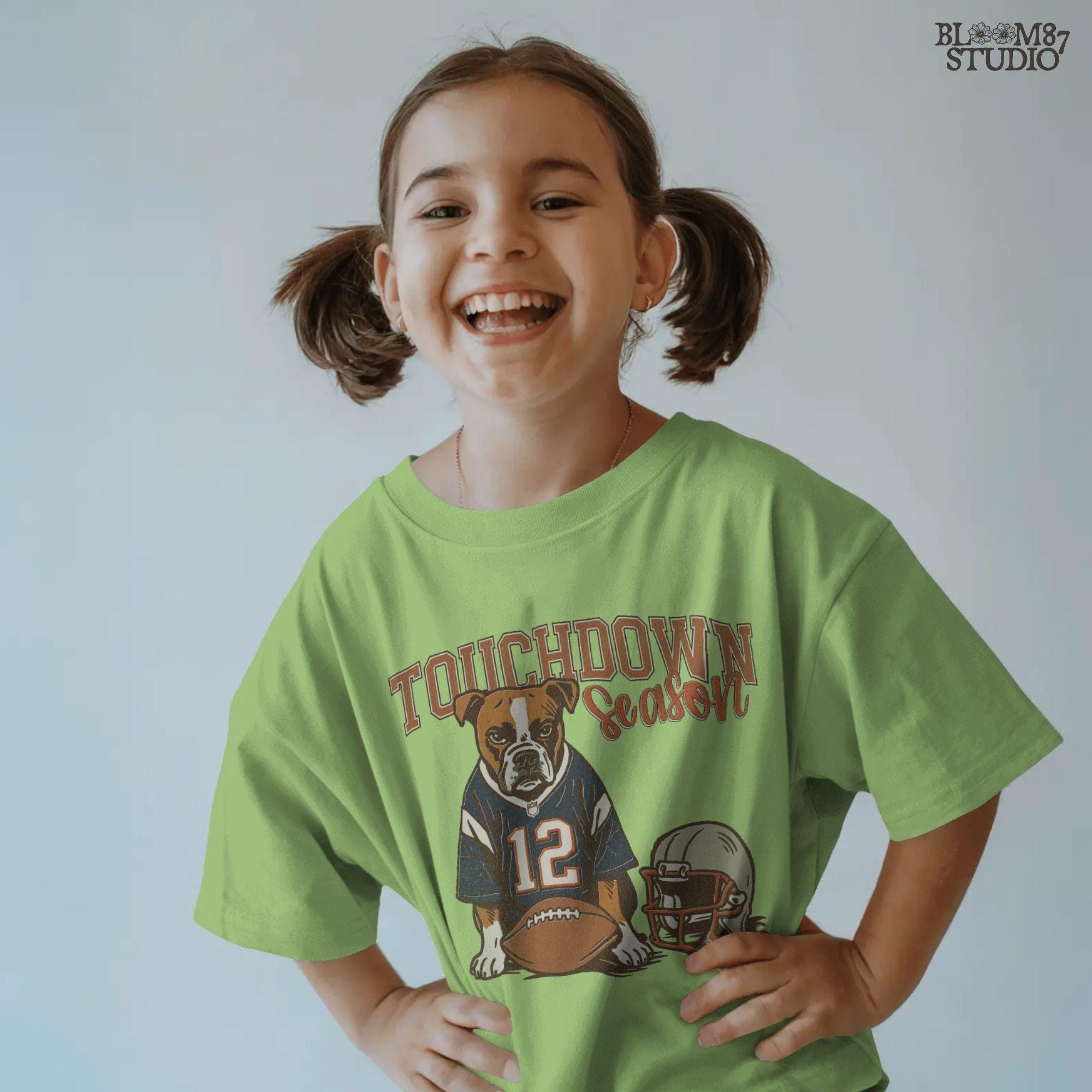 Illustration of a bulldog wearing a football jersey with helmet and ball, text “Touchdown Season” – sublimation PNG for sports fans and dog lovers