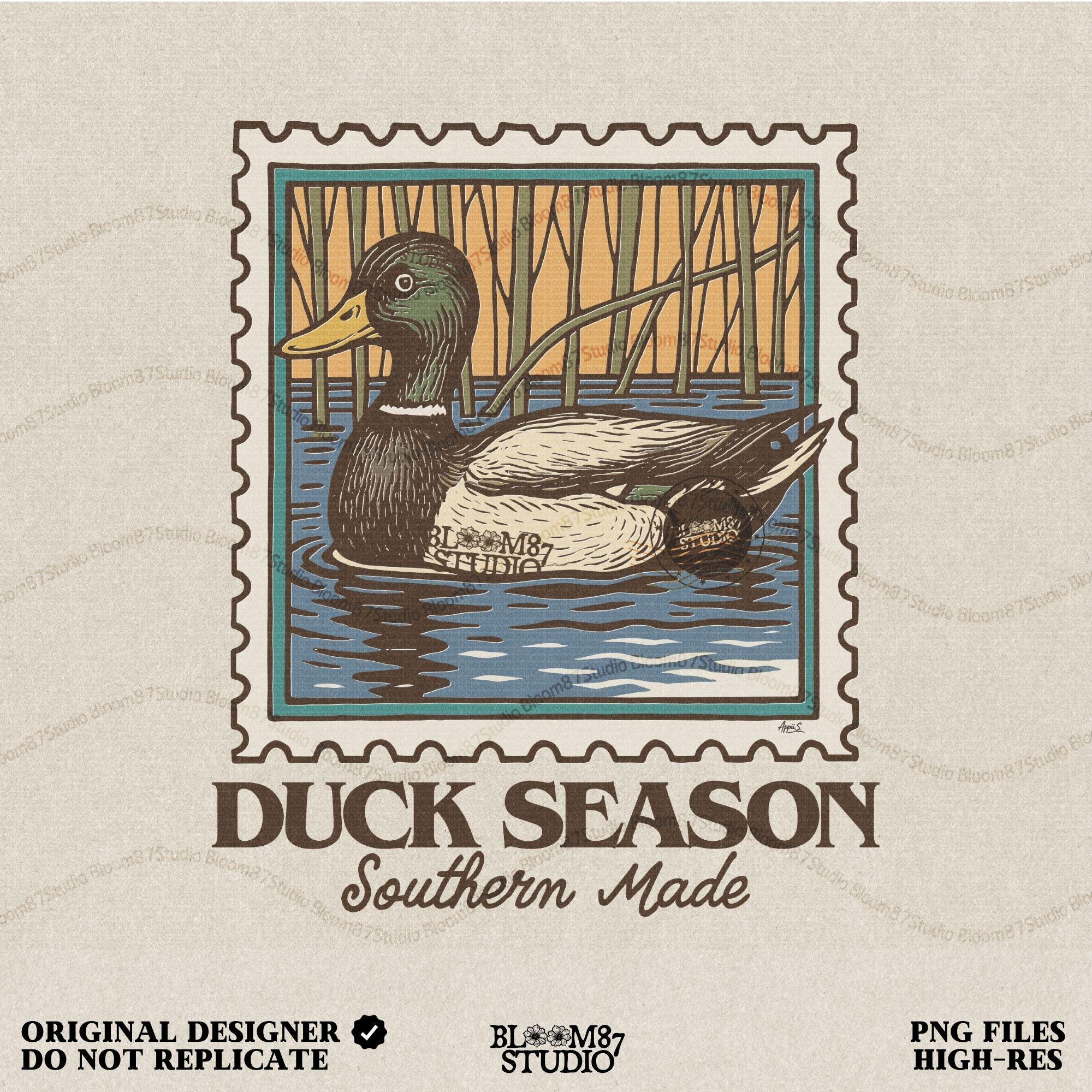 Vintage stamp-style mallard duck floating in water with forest background and text “Duck Season – Southern Made” in retro serif font.